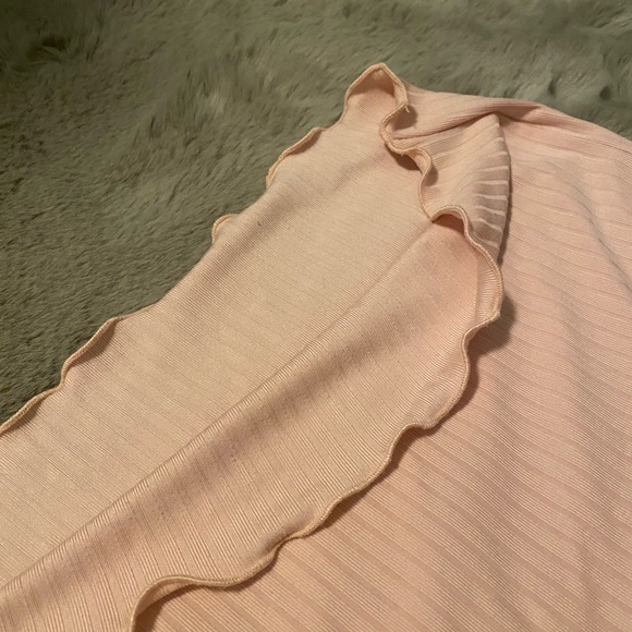 Arie pink shirt with ruffled endings on both arms and bottom. Good quality. - Picture 4 of 5